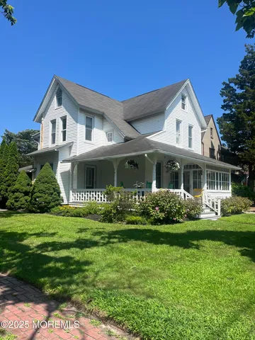 a front view of a house with a yard table and chairs