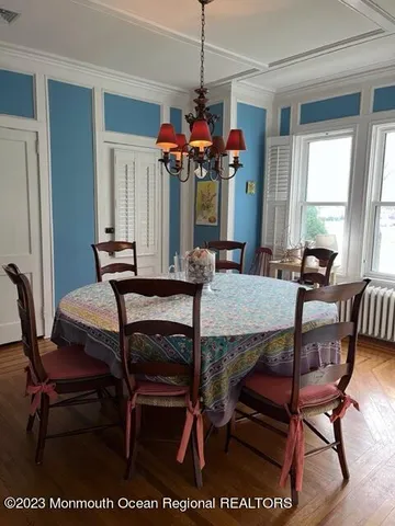 a view of a dining room with furniture and window