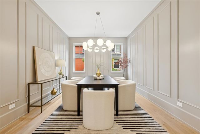 a kitchen with stainless steel appliances granite countertop a sink and a refrigerator