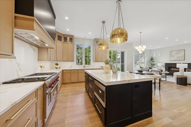a kitchen with a sink stove and cabinets