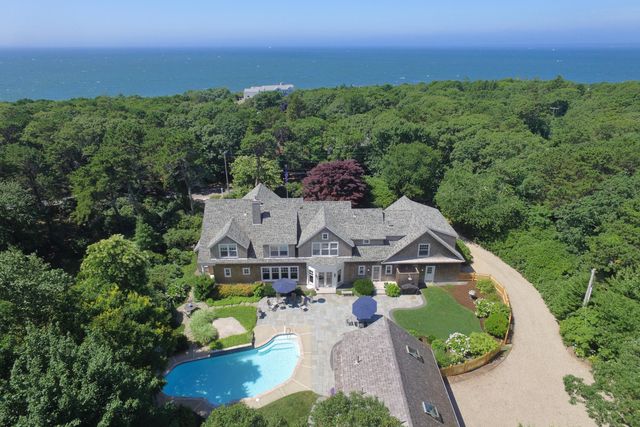 an aerial view of a house with a garden