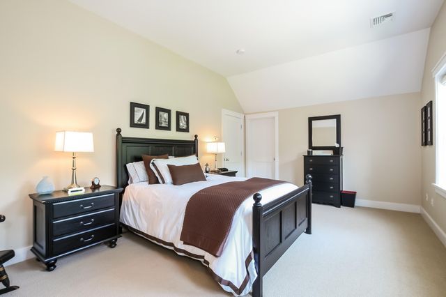 a bedroom with a bed and a tv