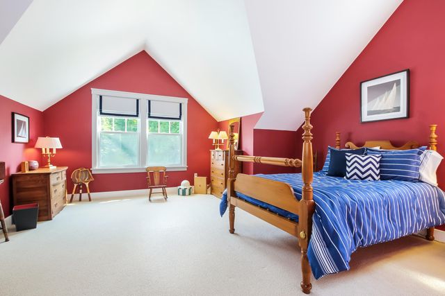 a bedroom with furniture and a window