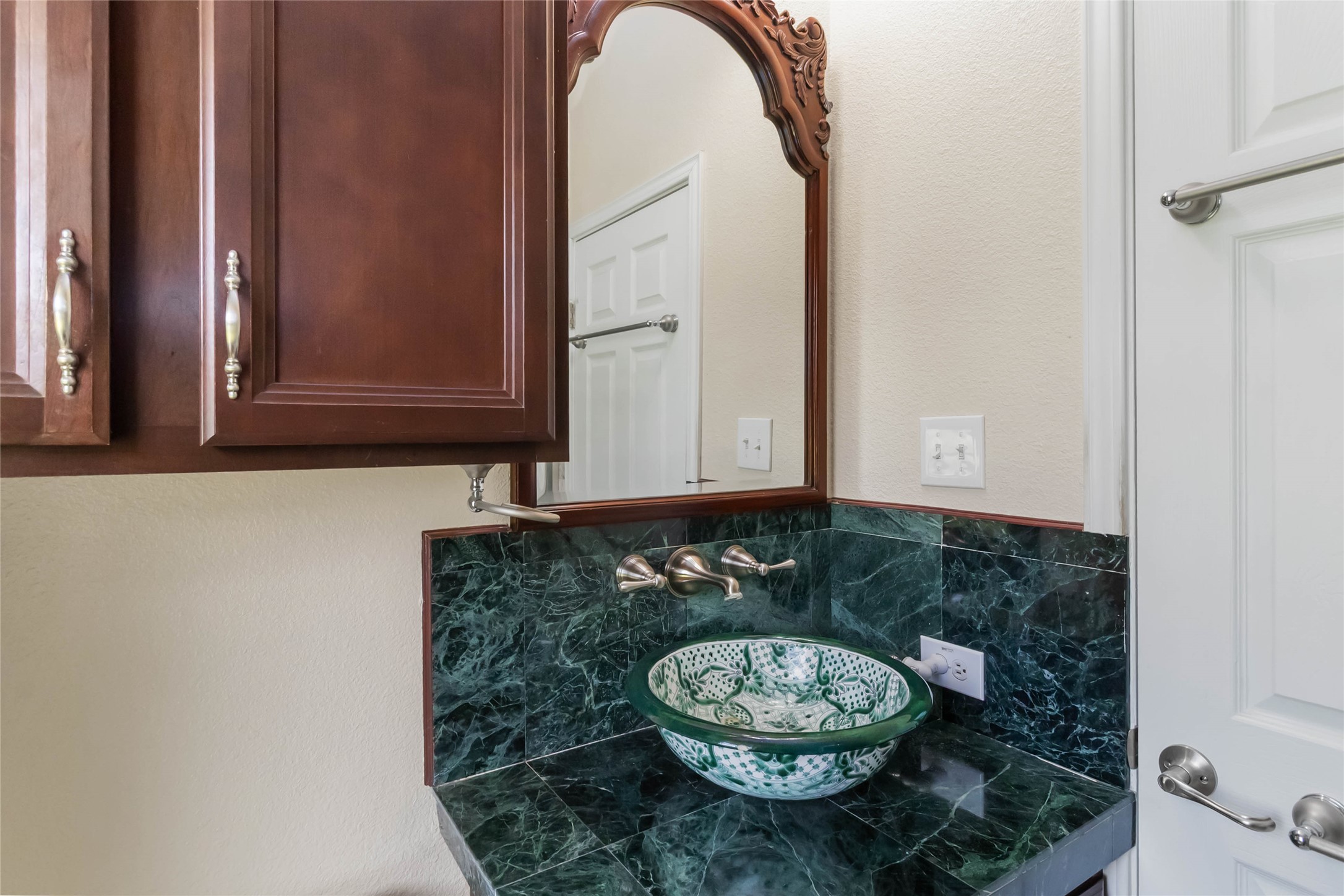 1208 Jeddo Road Rosanky, TX 78953 - Photo 13 of 40 A vessel sink with intricate patterns adds an artistic touch to this bathroom vanity.