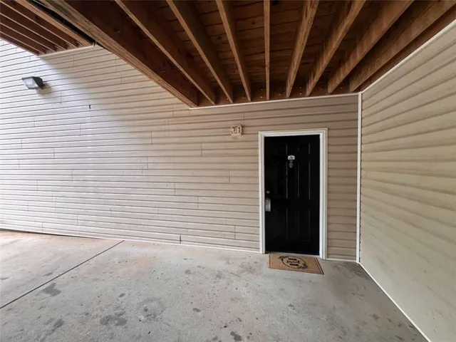 a view of an empty room with closet