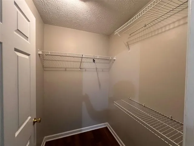 a view of a room with racks on the wall