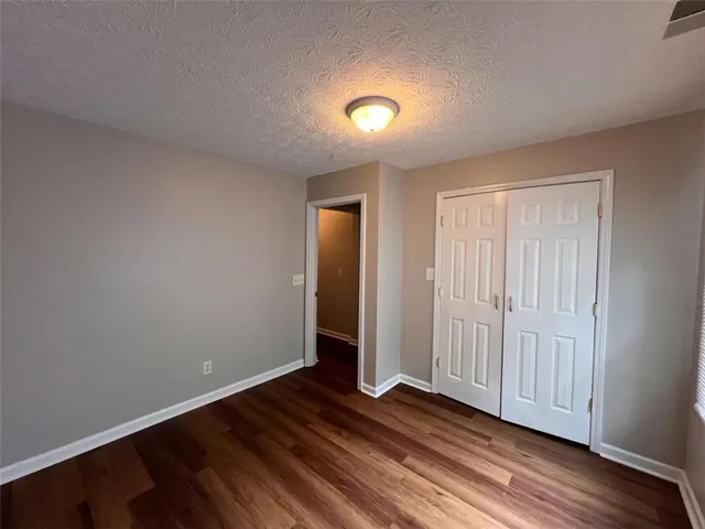 a view of a livingroom with wooden floor