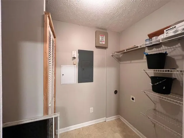 a view of a bedroom with wooden floor