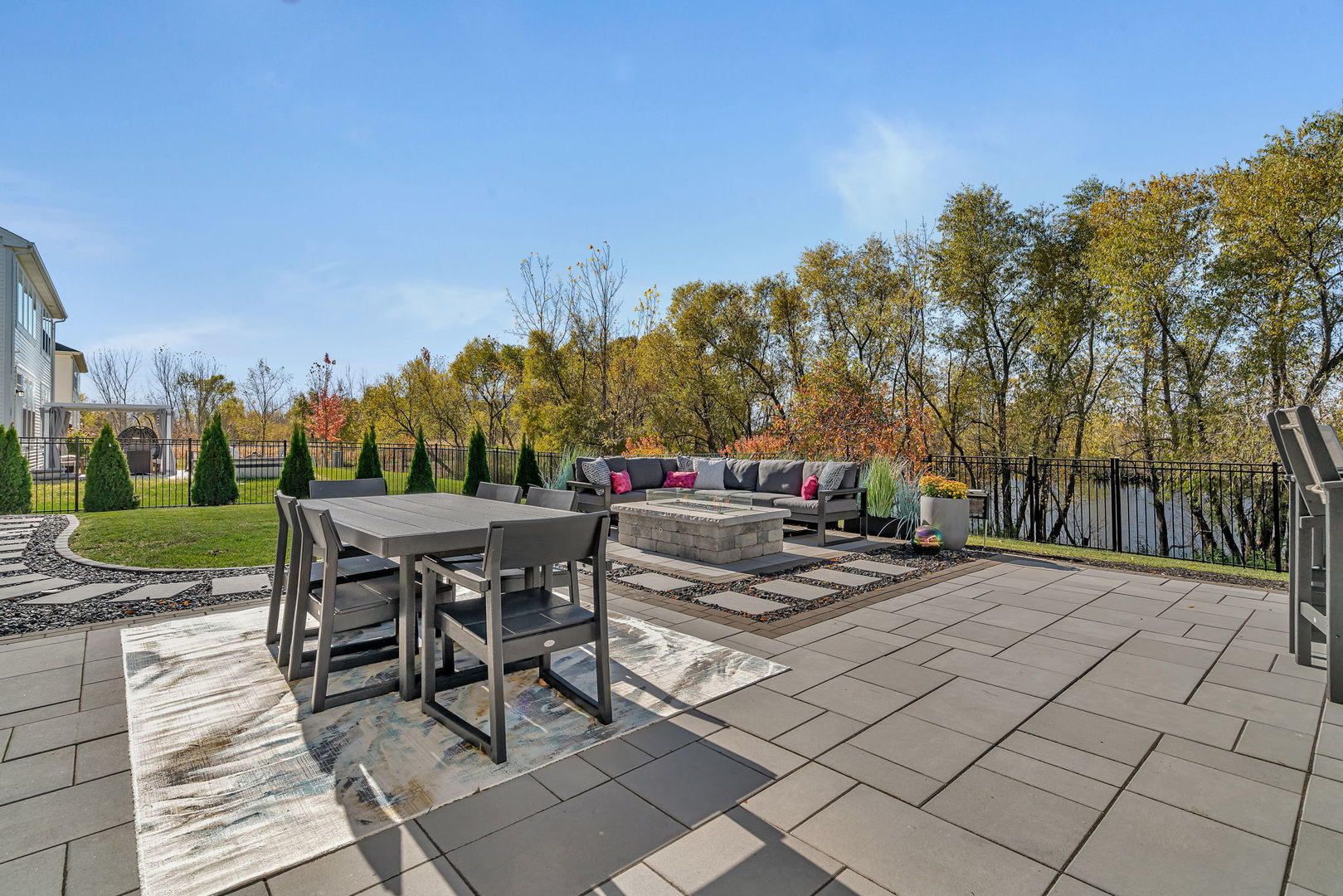 16230 Lake View Road Plainfield, IL 60586 - Photo 55 of 62 a view of a patio with table and chairs and potted plants