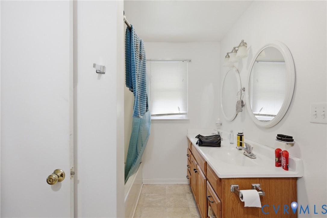 3590 Belle Meade Road Bumpass, VA 23024 - Photo 11 of 20 a bathroom with a sink vanity and a mirror