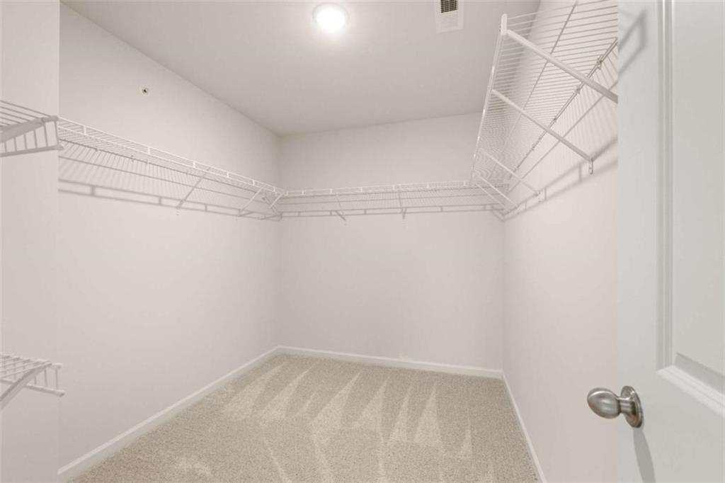 9452 Maple Grv Lane Jonesboro, GA 30238 - Photo 12 of 23 a view of a room with racks on the wall