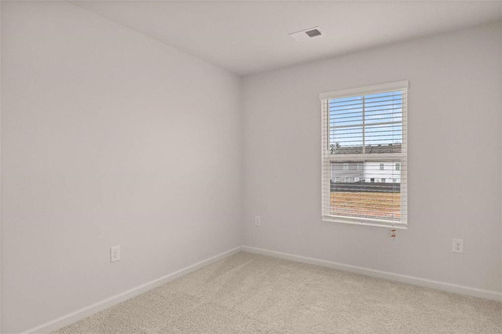 9452 Maple Grv Lane Jonesboro, GA 30238 - Photo 15 of 23 an empty room with a window