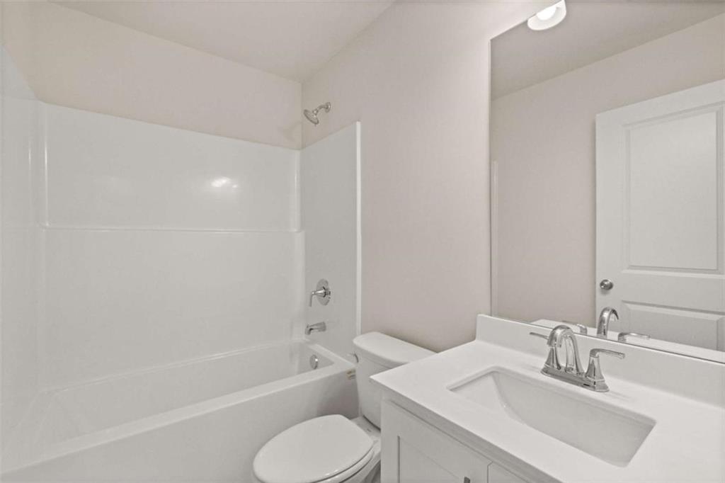 9452 Maple Grv Lane Jonesboro, GA 30238 - Photo 17 of 23 a bathroom with a sink toilet and shower