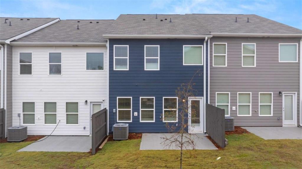 9452 Maple Grv Lane Jonesboro, GA 30238 - Photo 19 of 23 a front view of a house with a yard