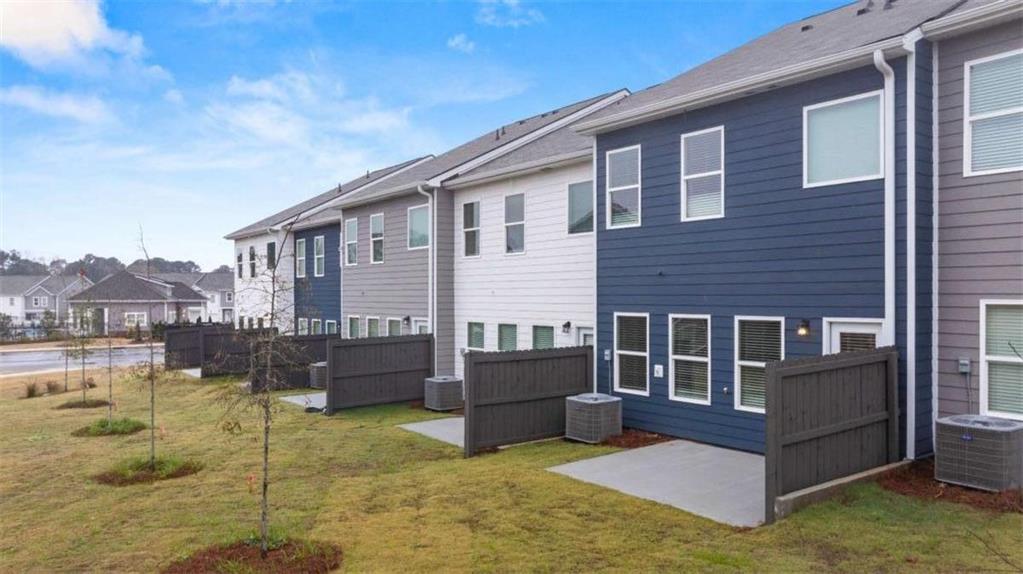 9452 Maple Grv Lane Jonesboro, GA 30238 - Photo 21 of 23 a front view of a house with a yard