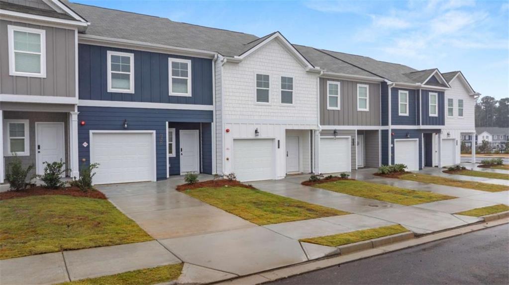 9452 Maple Grv Lane Jonesboro, GA 30238 - Photo 3 of 23 a front view of a house with a yard