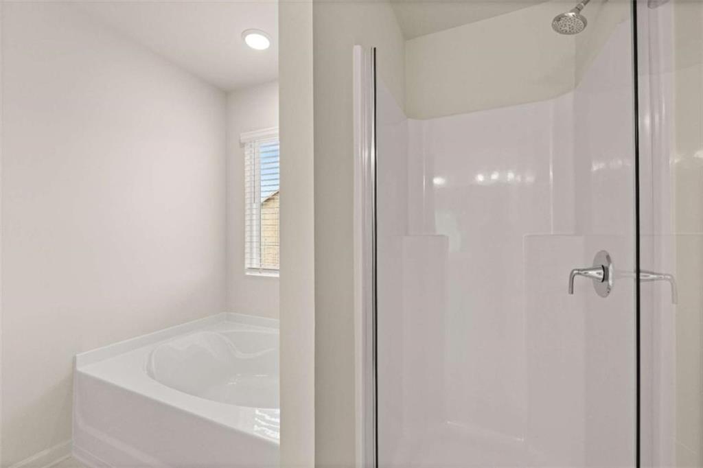 9452 Maple Grv Lane Jonesboro, GA 30238 - Photo 10 of 23 a bathroom with a tub and shower