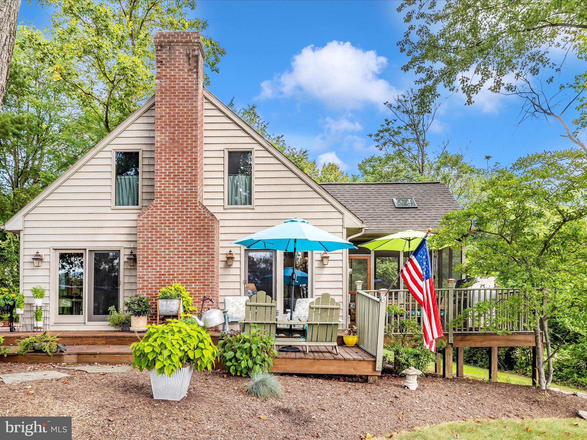 8560 Rocky Springs Road Frederick, MD 21702 - Photo 1 of 50 a view of a house with potted plants and a large tree