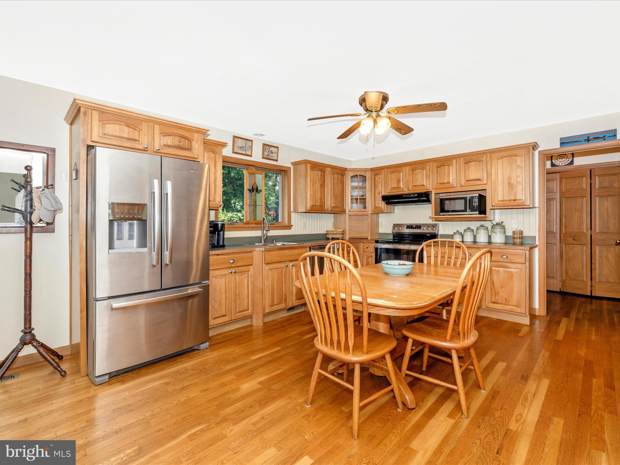 8560 Rocky Springs Road Frederick, MD 21702 - Photo 12 of 50 a view of a dining room with furniture wooden floor and chandelier