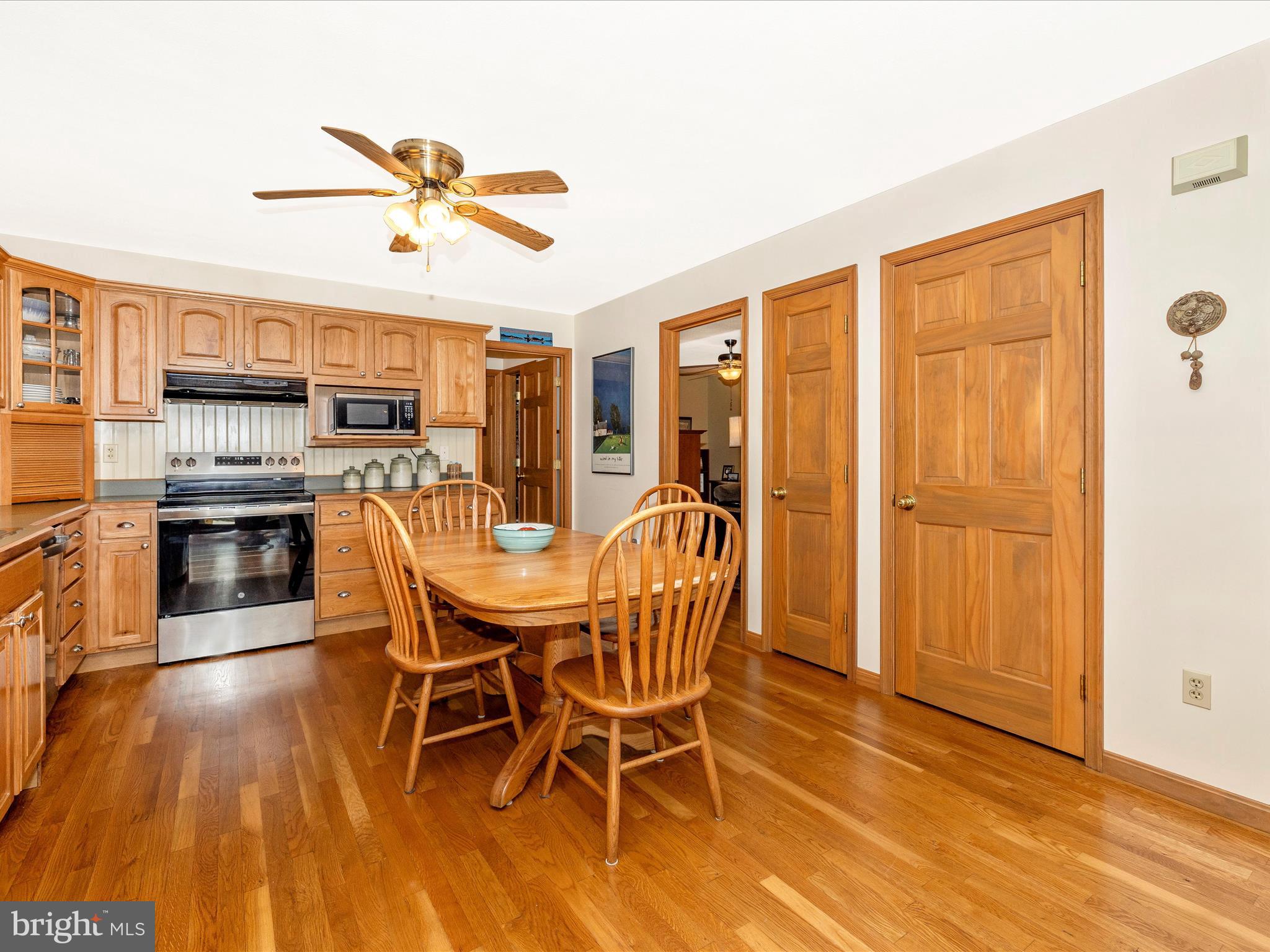 8560 Rocky Springs Road Frederick, MD 21702 - Photo 14 of 50 a view of a dining room with furniture window and wooden floor