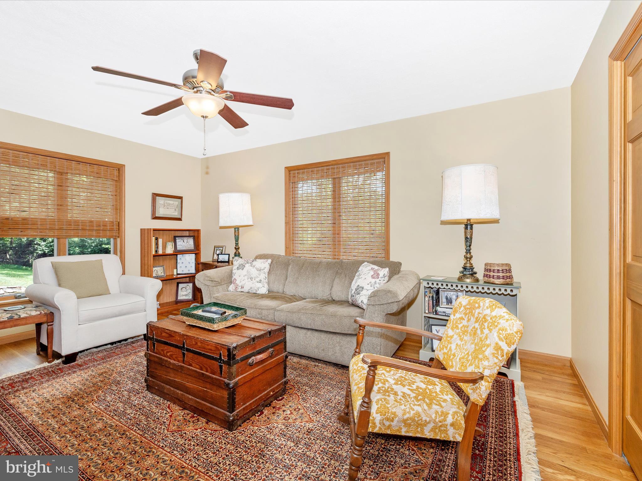 8560 Rocky Springs Road Frederick, MD 21702 - Photo 18 of 50 a living room with furniture and a lamp