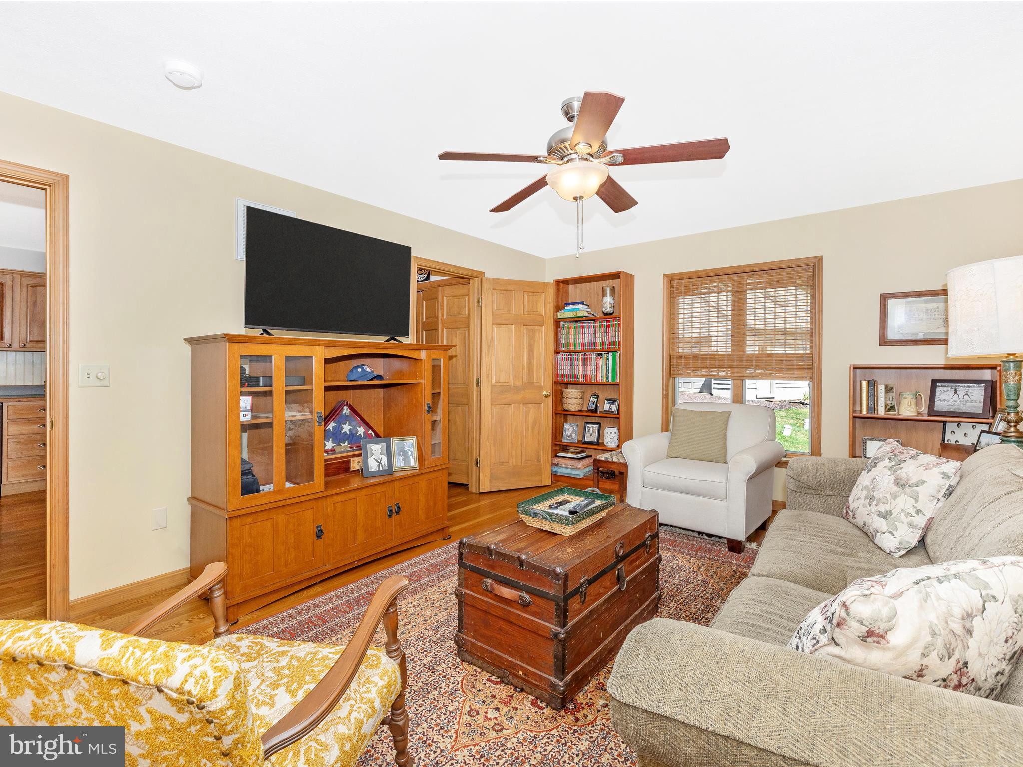 8560 Rocky Springs Road Frederick, MD 21702 - Photo 19 of 50 a living room with furniture and a flat screen tv