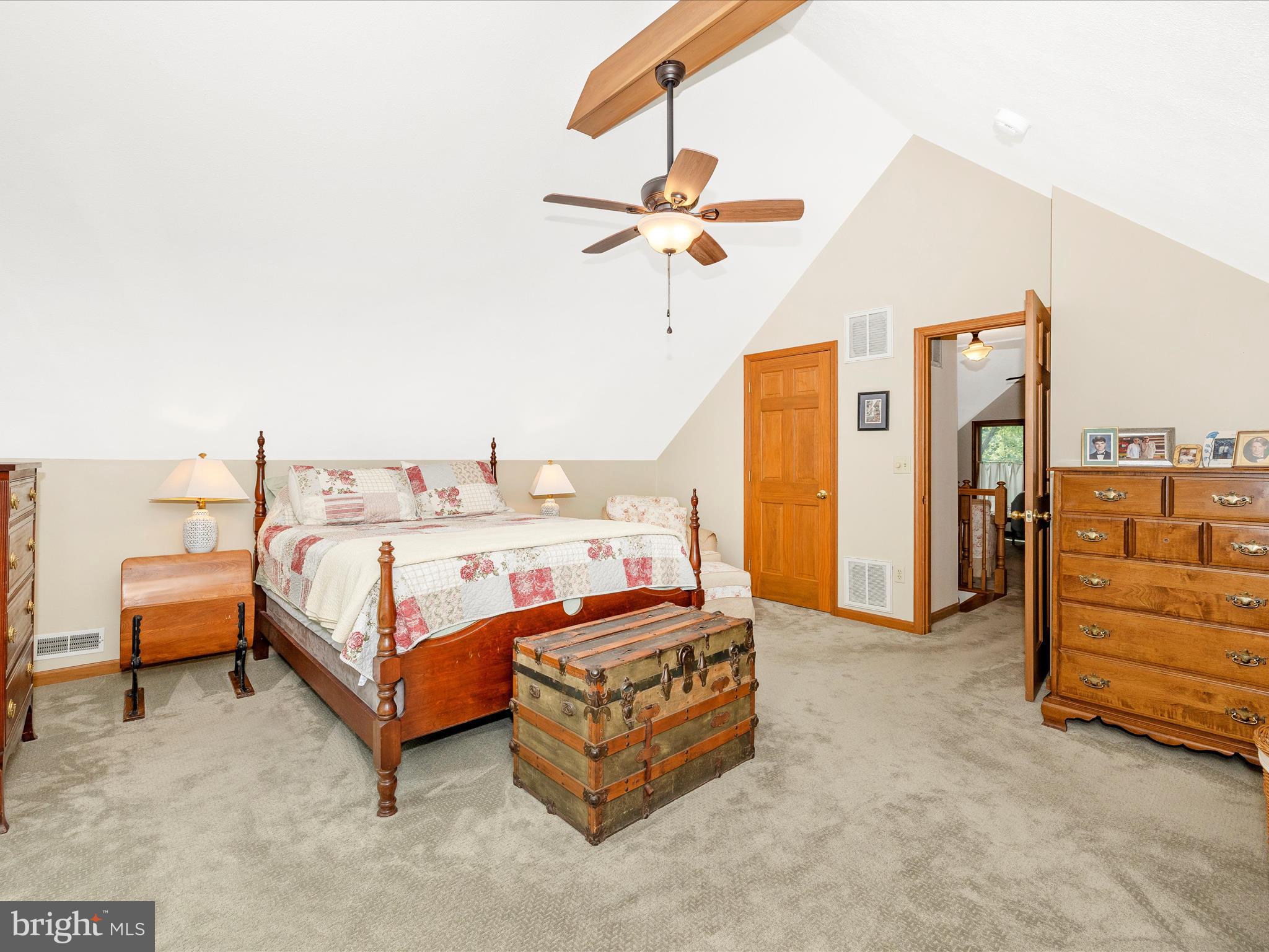 8560 Rocky Springs Road Frederick, MD 21702 - Photo 33 of 50 a bedroom with a bed and a chandelier