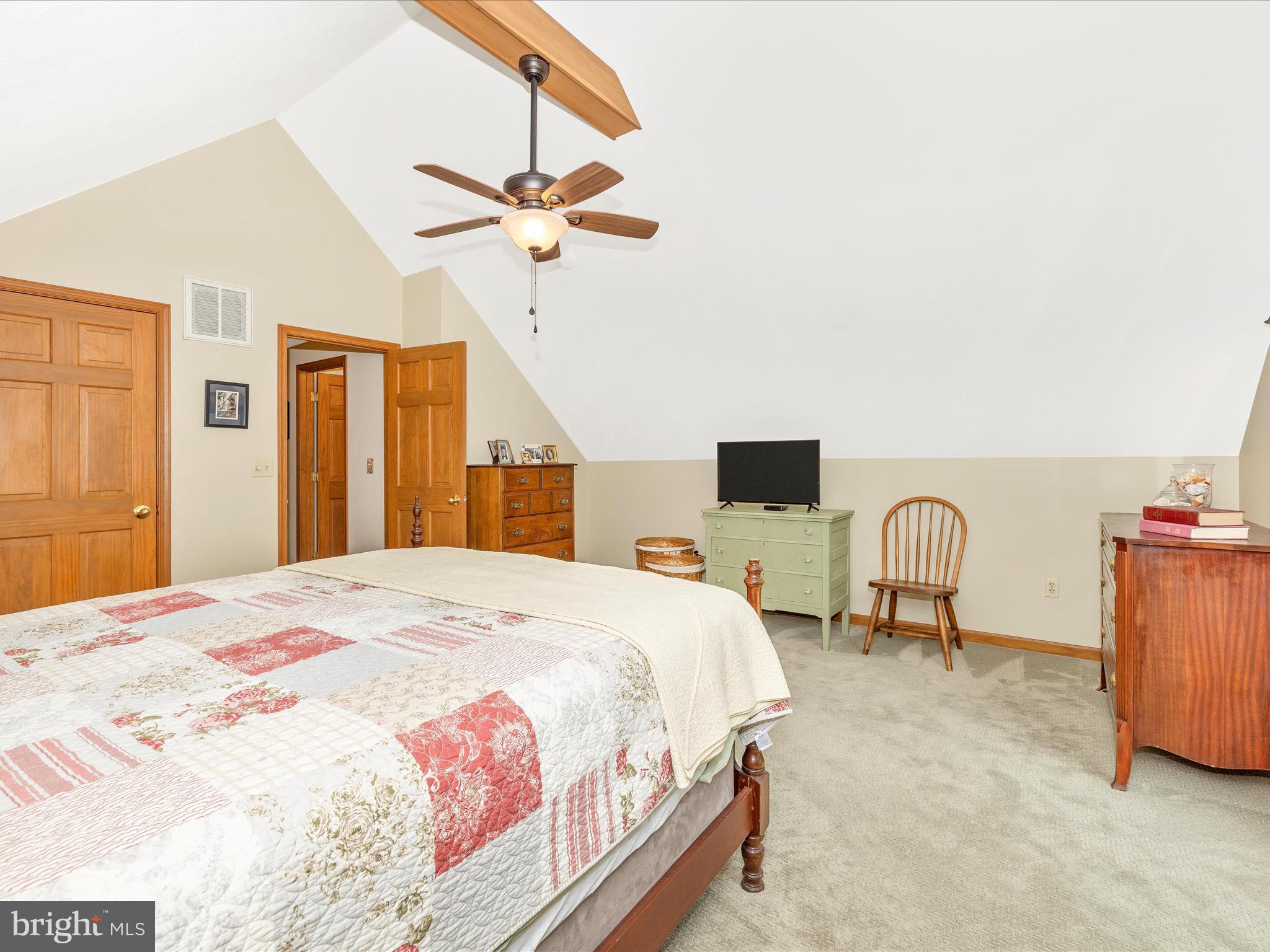 8560 Rocky Springs Road Frederick, MD 21702 - Photo 34 of 50 a bedroom with a bed and dresser with wooden floor