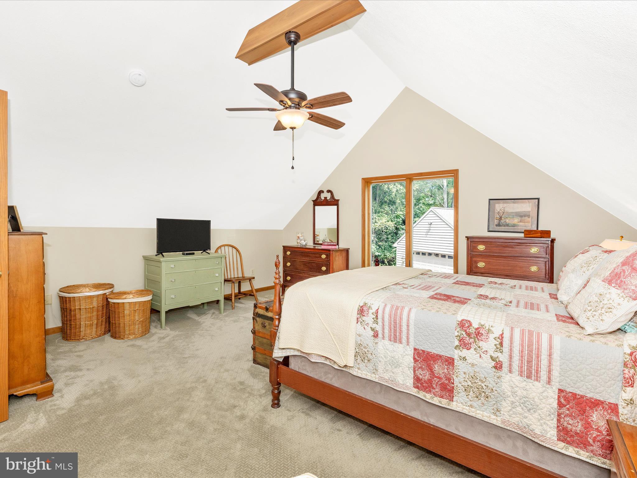 8560 Rocky Springs Road Frederick, MD 21702 - Photo 35 of 50 a bedroom with a bed and a chandelier