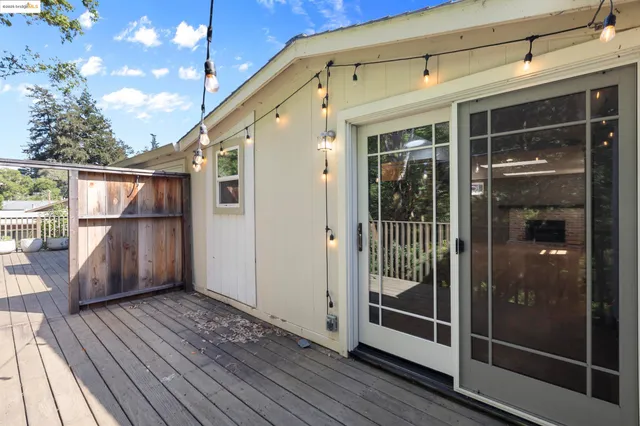 a view of a balcony with wooden floor