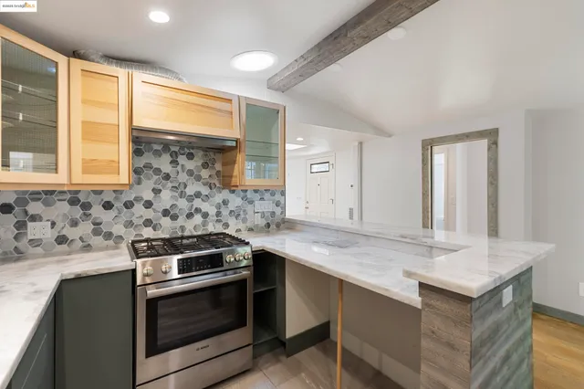 a kitchen that has a sink and a stove