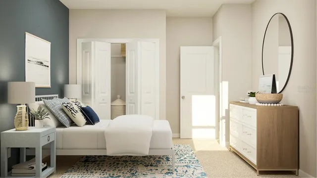 a bedroom with a bed a mirror and lamp