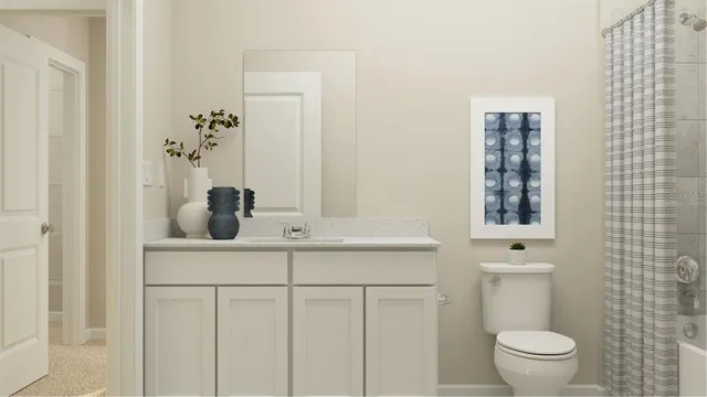 a bathroom with a granite countertop sink a toilet and a mirror