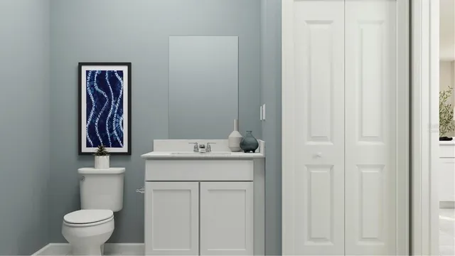 a bathroom with a sink toilet and vanity