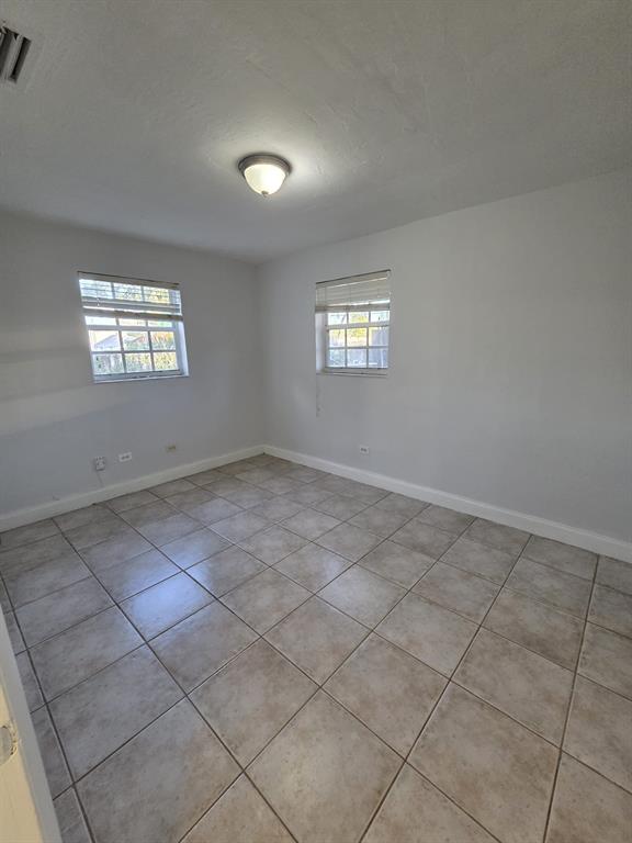 5751 Southwest 37th Street Davie, FL 33314 - Photo 5 of 11 an empty room with windows