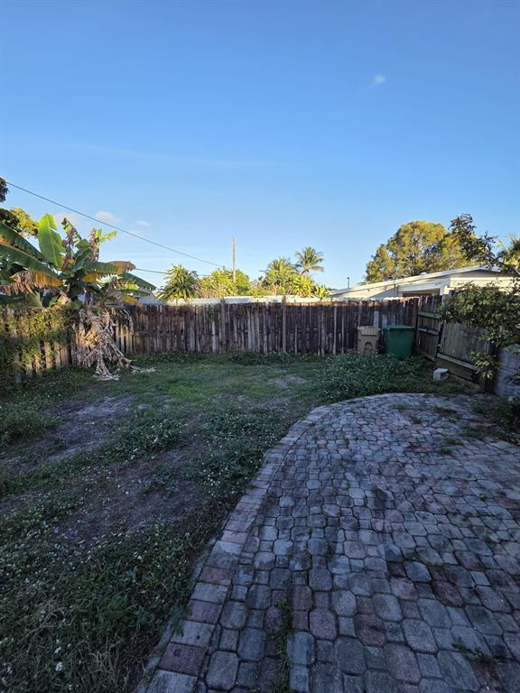 5751 Southwest 37th Street Davie, FL 33314 - Photo 6 of 11 a view of a garden with a building in the background