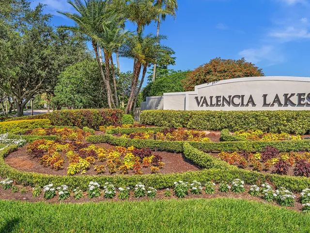 a view of a swimming pool with a table and chairs