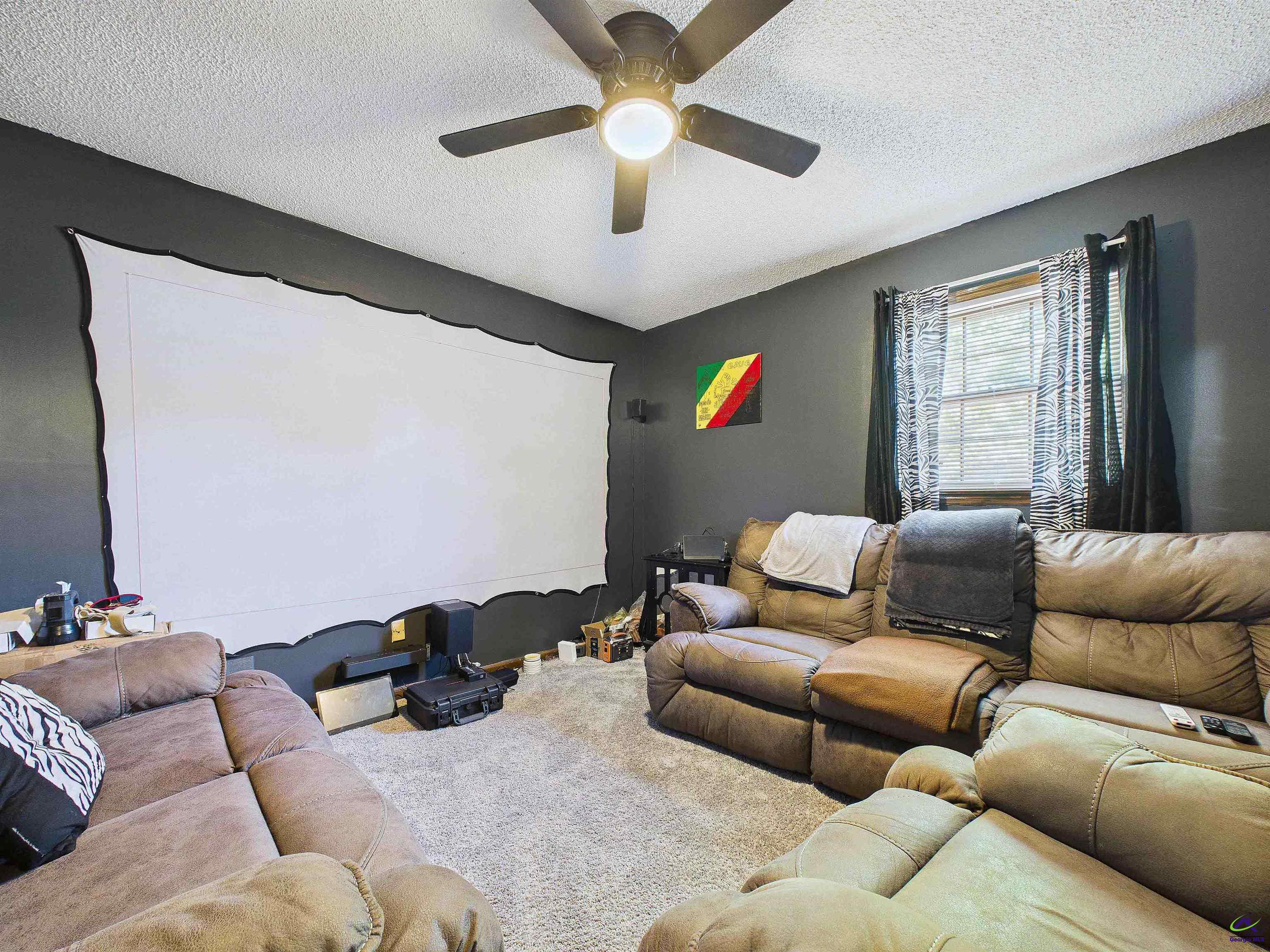 400 Feagin Mill Road Warner Robins, GA 31005 - Photo 41 of 53 a living room with furniture and a ceiling fan