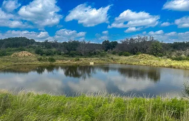 a view of a lake in between the city