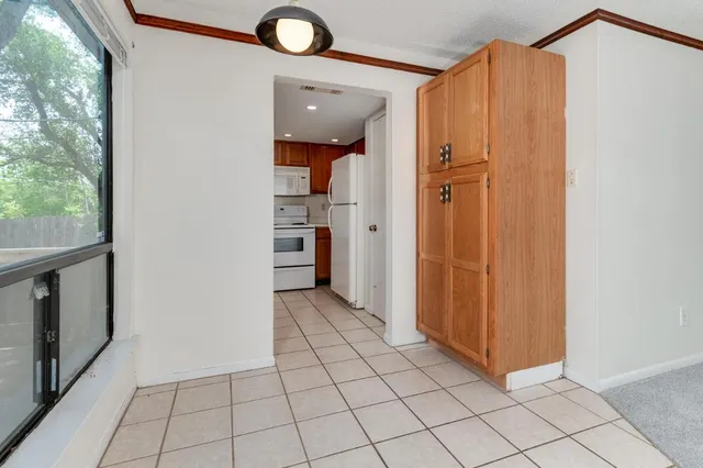 a kitchen with stainless steel appliances granite countertop a sink a stove and cabinets