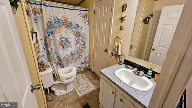 a bed room with furniture and a wooden floor