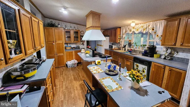 a very nice looking dining room with furniture window and wooden floor