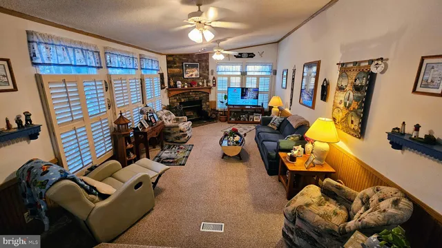 a view of a livingroom with furniture and a window