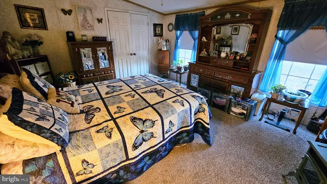 a bed room with a bed and a television