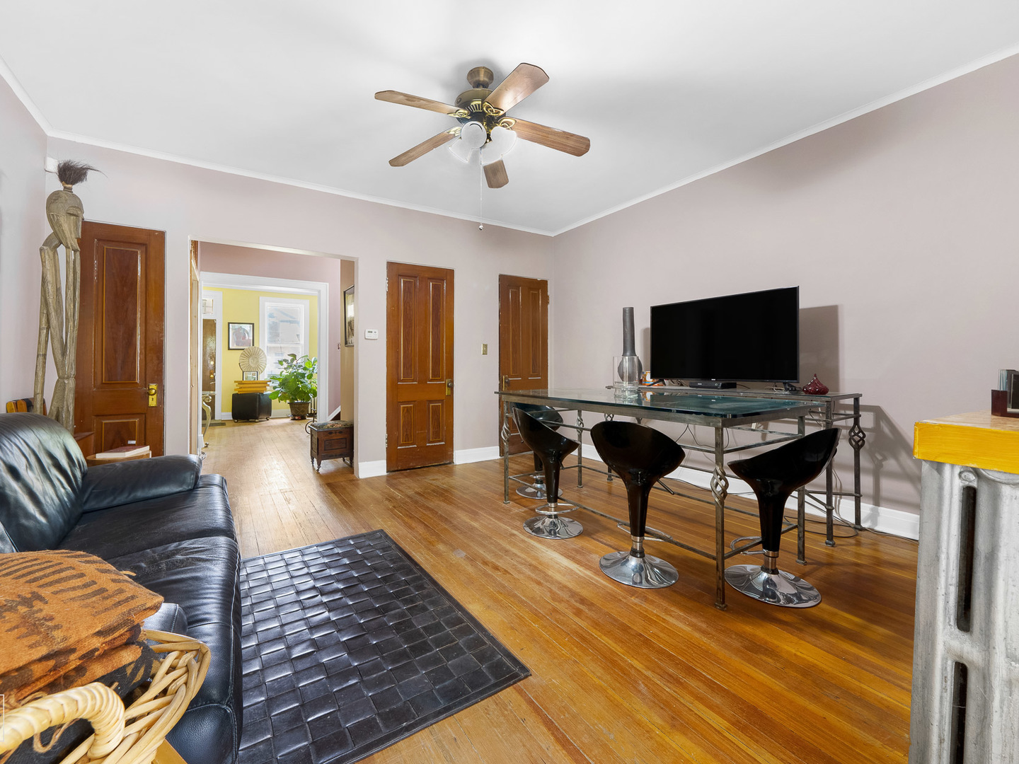 11349 South St Lawrence Avenue, Unit ROWHSE Chicago, IL 60628 - Photo 11 of 22 a living room with furniture and a flat screen tv