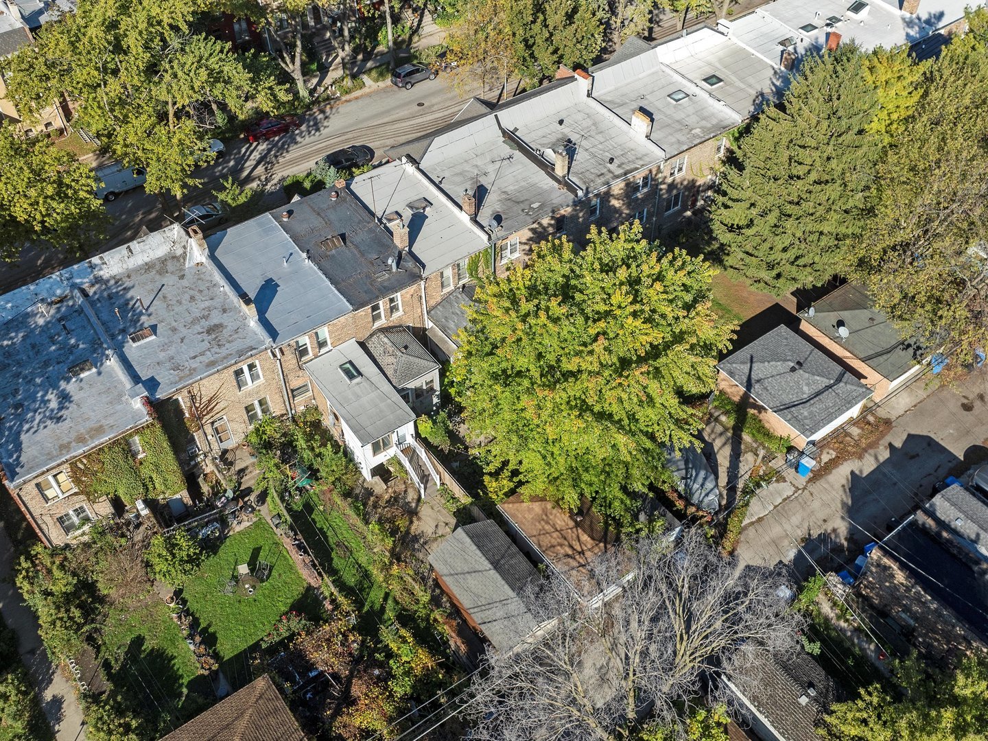 11349 South St Lawrence Avenue, Unit ROWHSE Chicago, IL 60628 - Photo 22 of 22 an aerial view of a house with a yard and garden