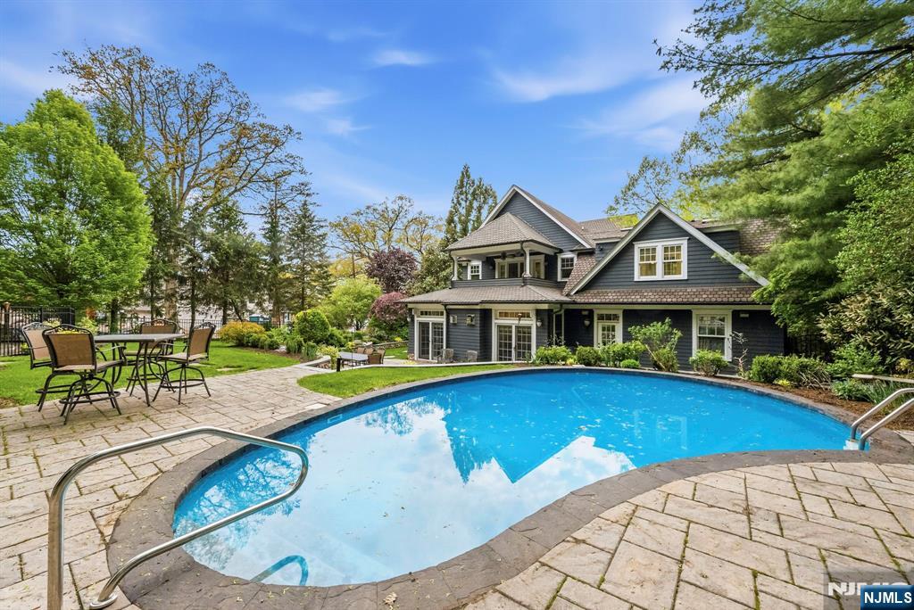 203 Heights Road Ridgewood, NJ 07450 - Photo 38 of 41 swimming pool view with a seating space and a garden view