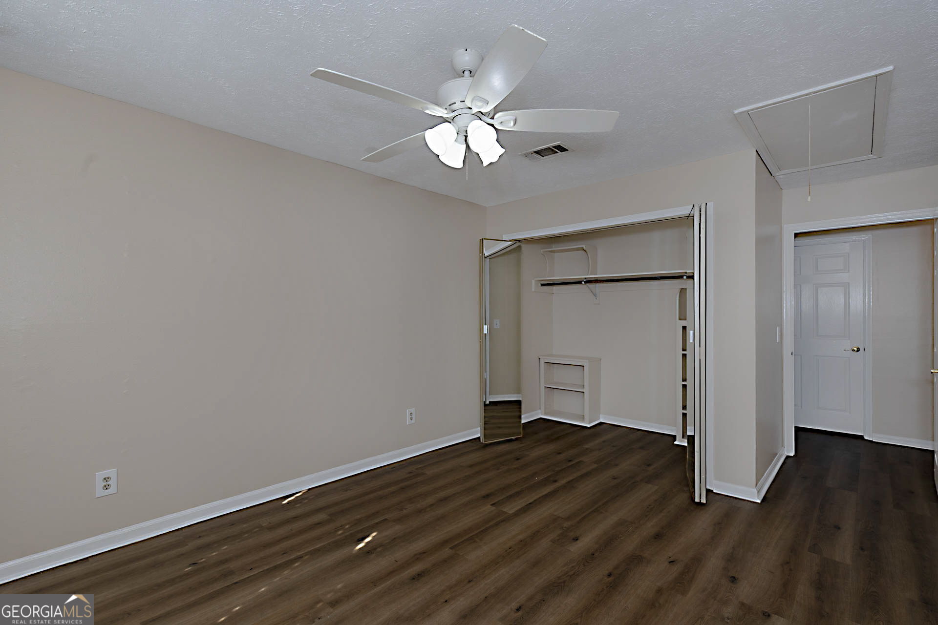 6101 River Road, Unit 2 Columbus, GA 31904 - Photo 15 of 27 a view of a livingroom with wooden floor and a ceiling fan