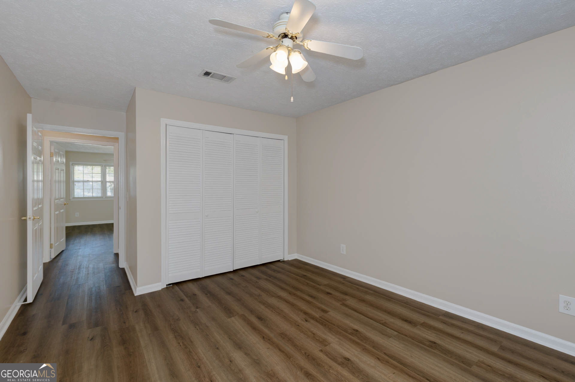 6101 River Road, Unit 2 Columbus, GA 31904 - Photo 17 of 27 wooden floor in an empty room with a window