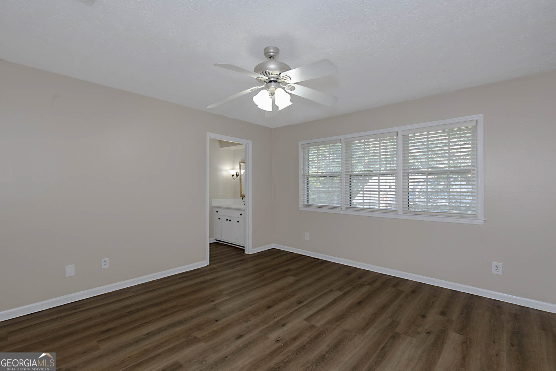 6101 River Road, Unit 2 Columbus, GA 31904 - Photo 18 of 27 wooden floor in an empty room with a window